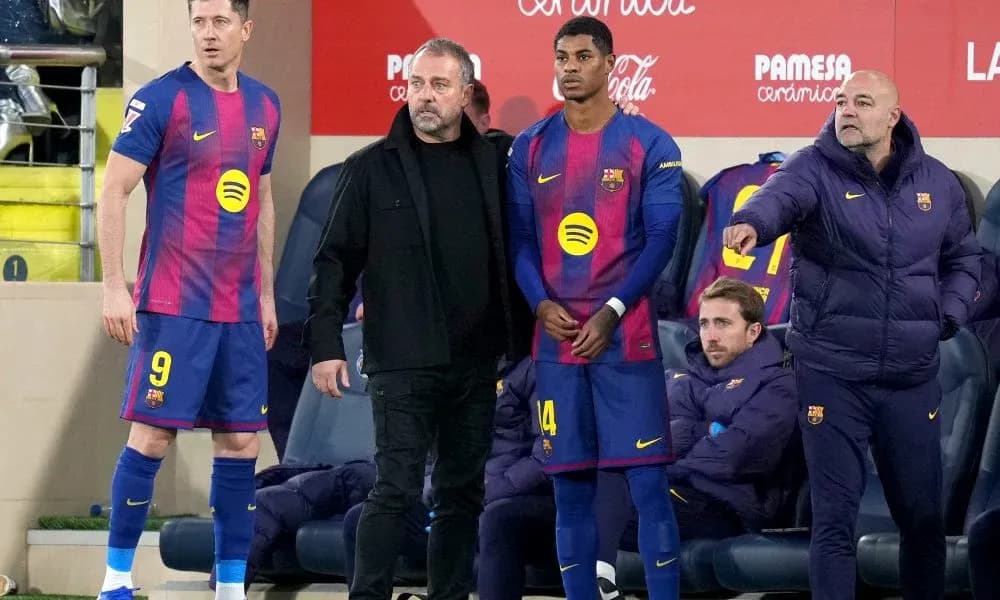 Barcelona players and coach on the sidelines during match