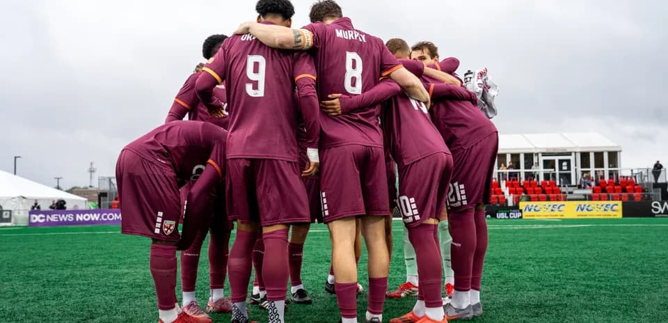 Loudoun United players in huddle before match
