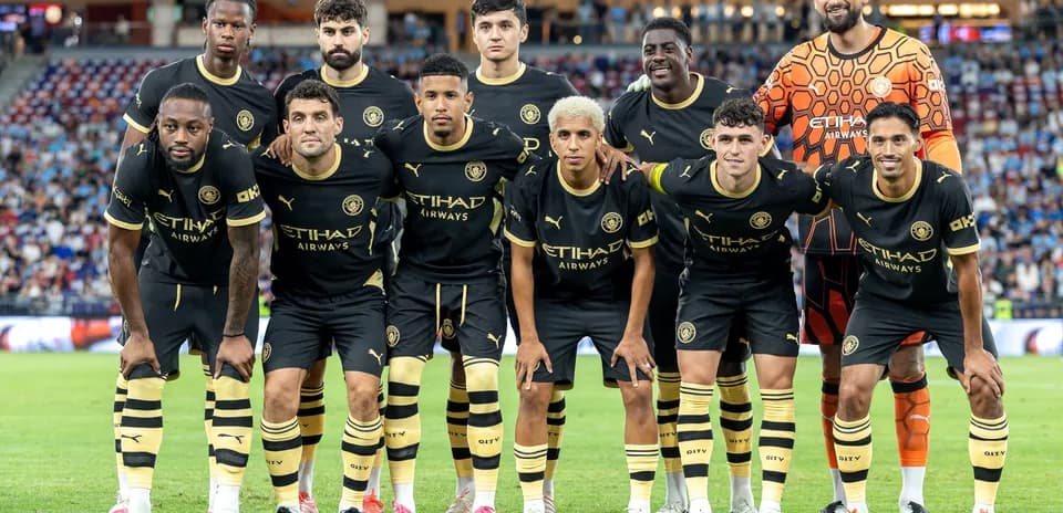 Soccer team posing for group photo in uniforms