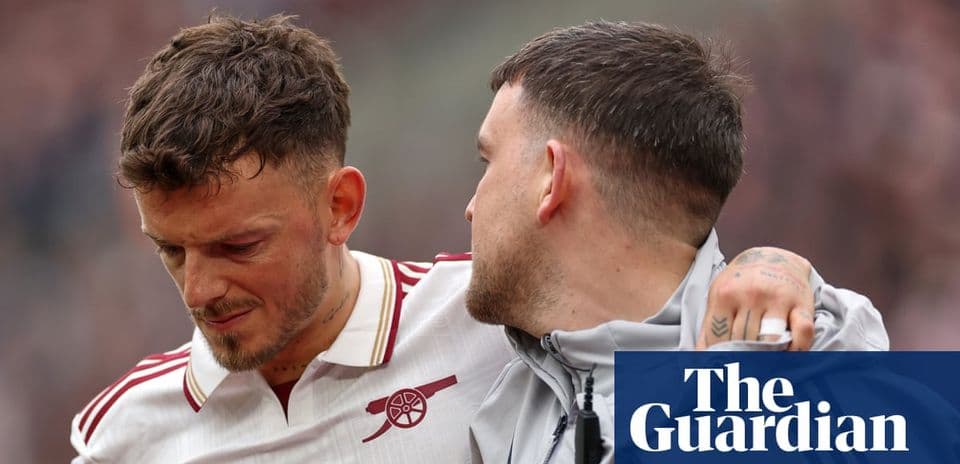 Two players, one comforting the other on field