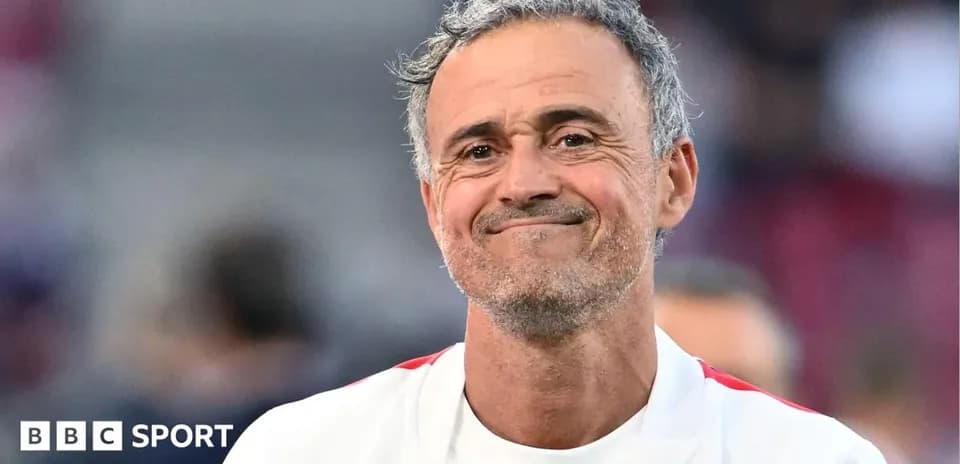 Coach smiling during a pre-match event
