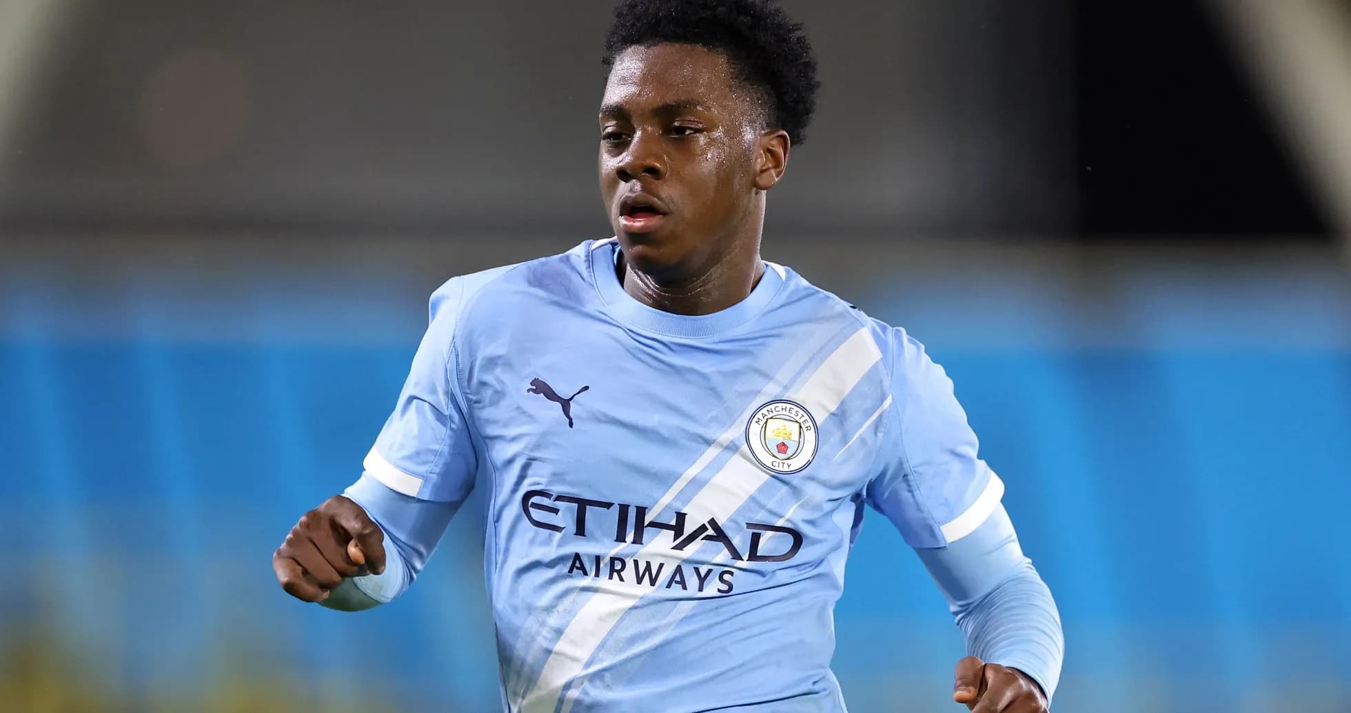 Player running in Manchester City training kit