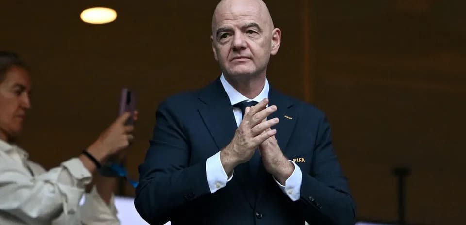 FIFA official applauding during an event