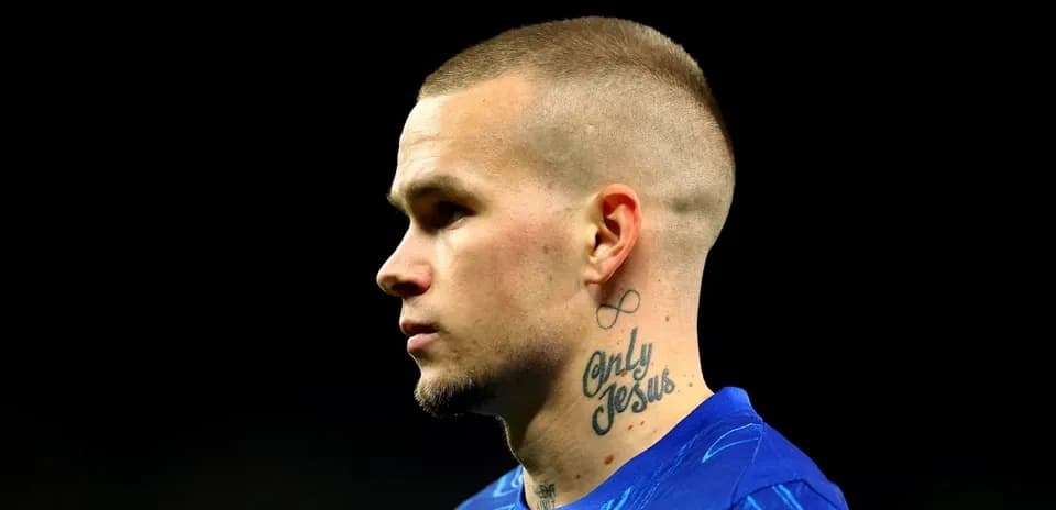 Player with tattoo during match warm-up