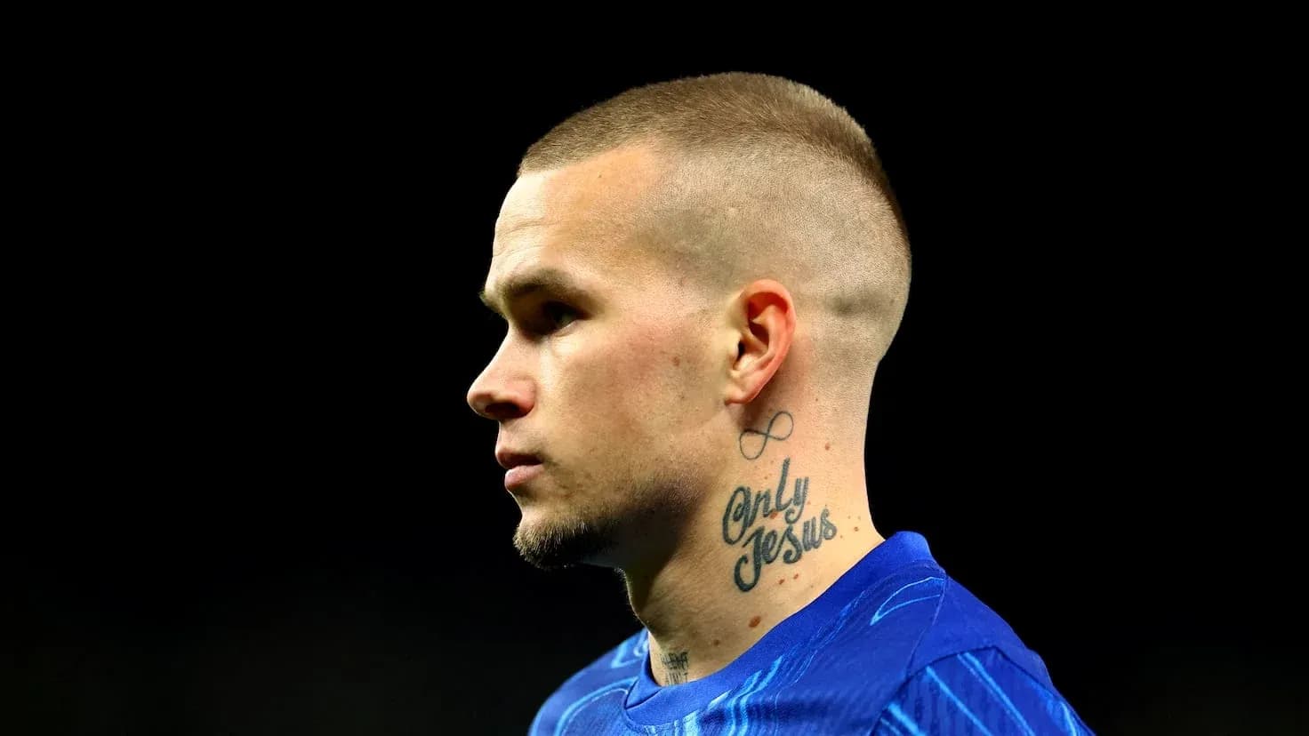 Player with tattoo during match warm-up
