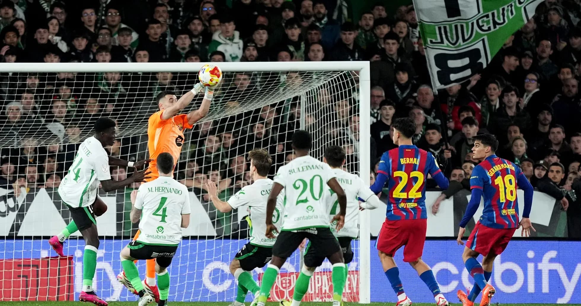 Goalkeeper catching the ball during a match