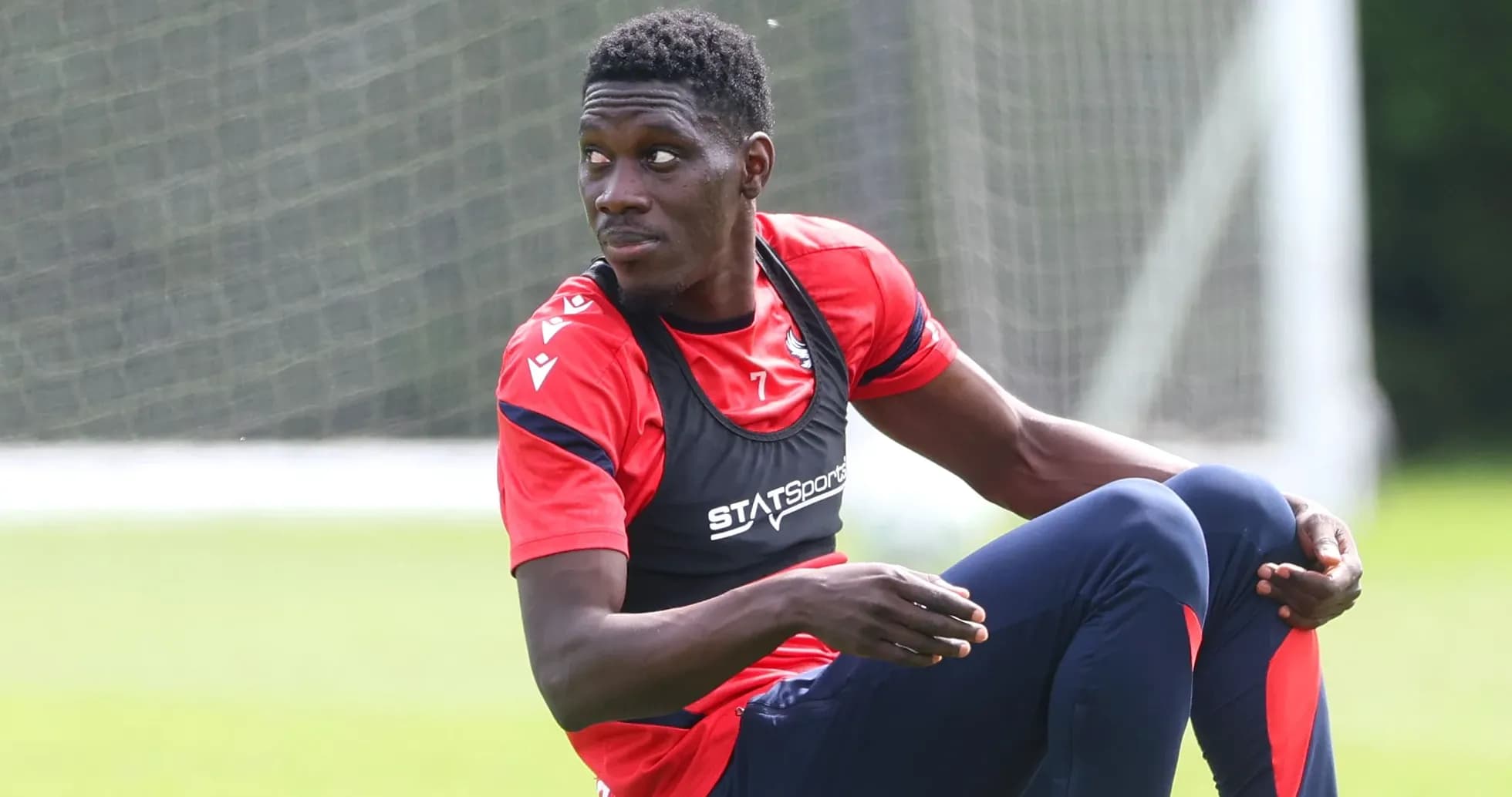 Player sitting on field during training session