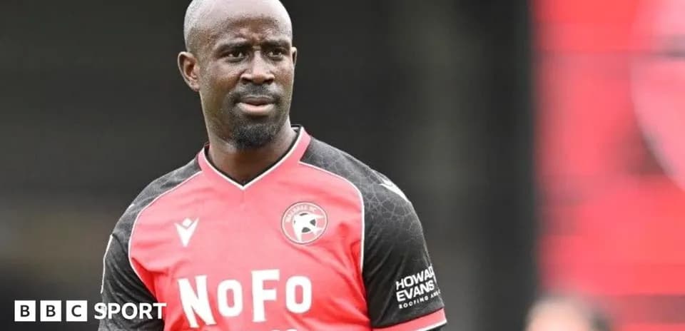 Player in red and black kit during training session
