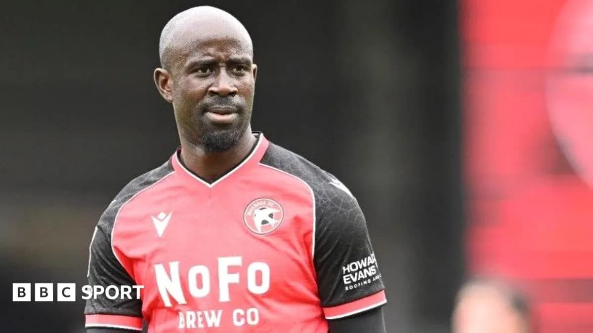 Player in red and black kit during training session