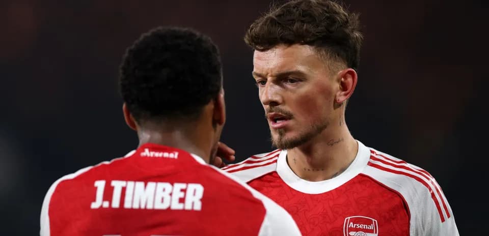 Two Arsenal players discussing during a match