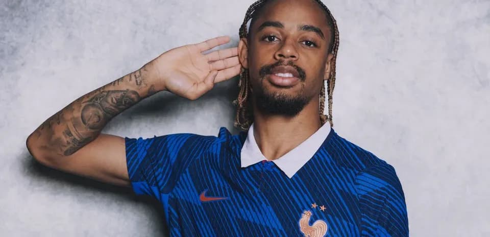 Player posing in blue France national team jersey