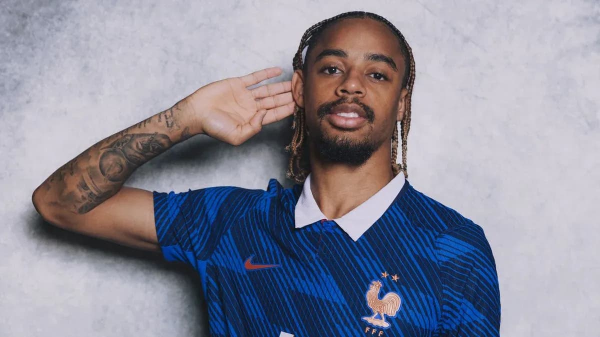 Player posing in blue France national team jersey