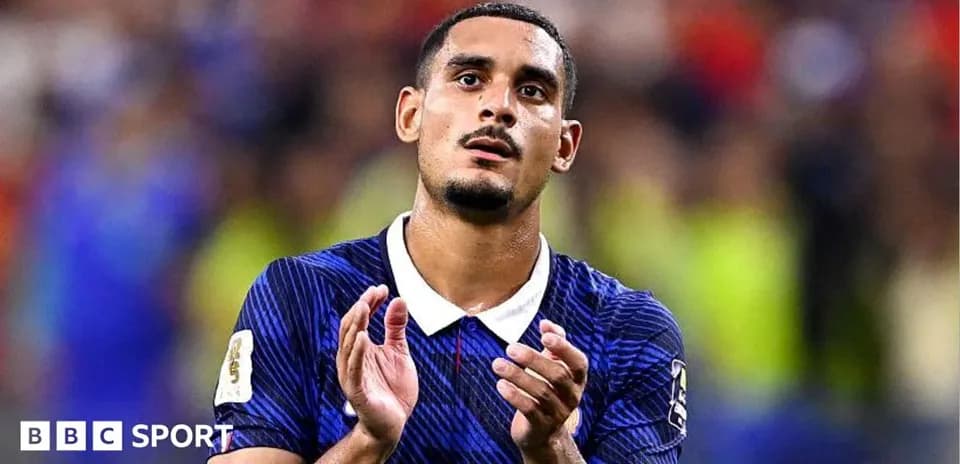 Player applauding after match wearing blue jersey