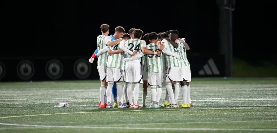 Players huddling before the match begins