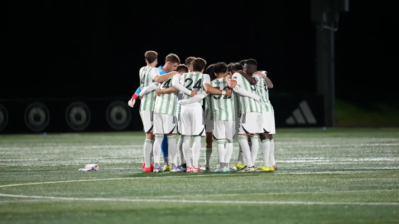Players huddling before the match begins