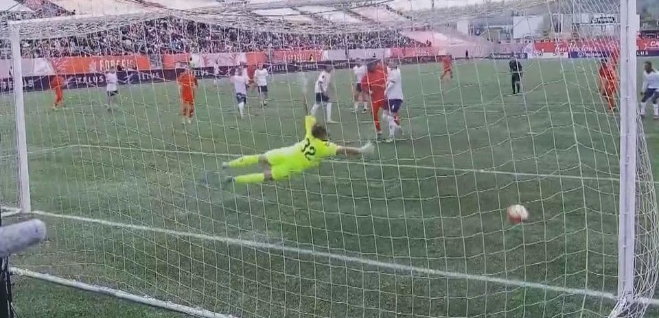 Goalkeeper diving to save a penalty kick