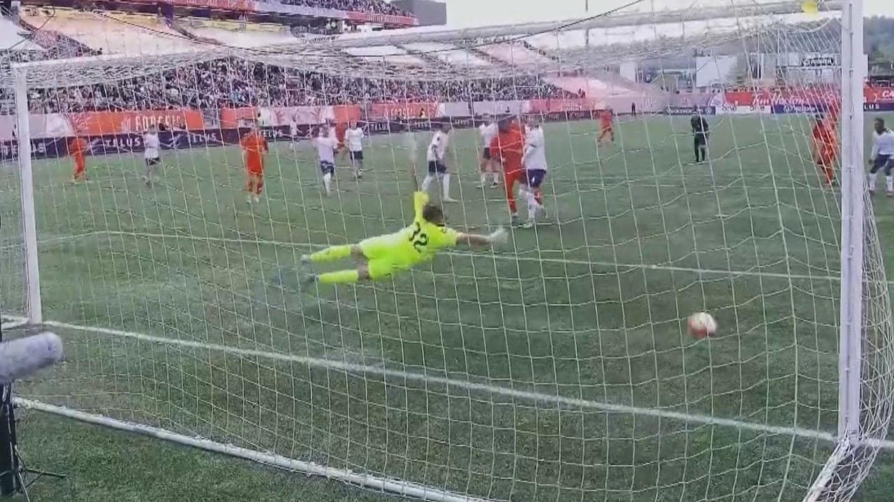 Goalkeeper diving to save a penalty kick