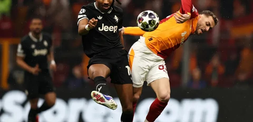 Two players battling for the ball during match