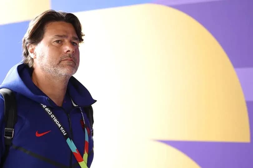 Coach walking in front of colorful background