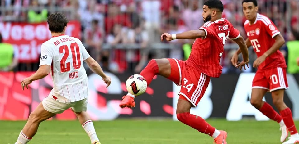 Player from FC Bayern kicking ball during match