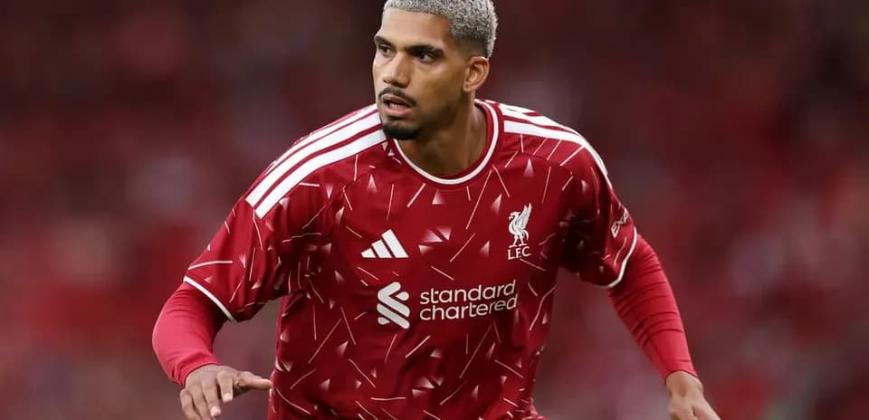 Player in Liverpool kit during match warm-up