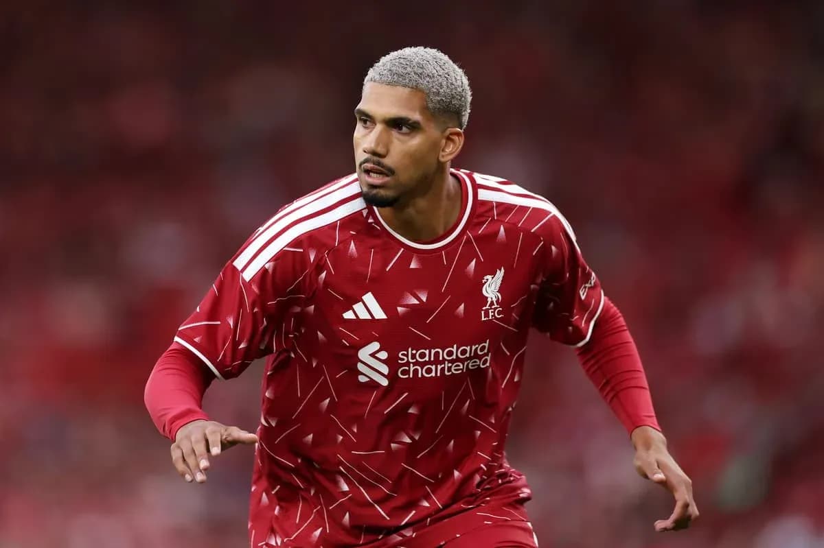 Player in Liverpool kit during match warm-up