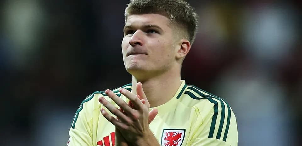 Player applauding in yellow kit after match