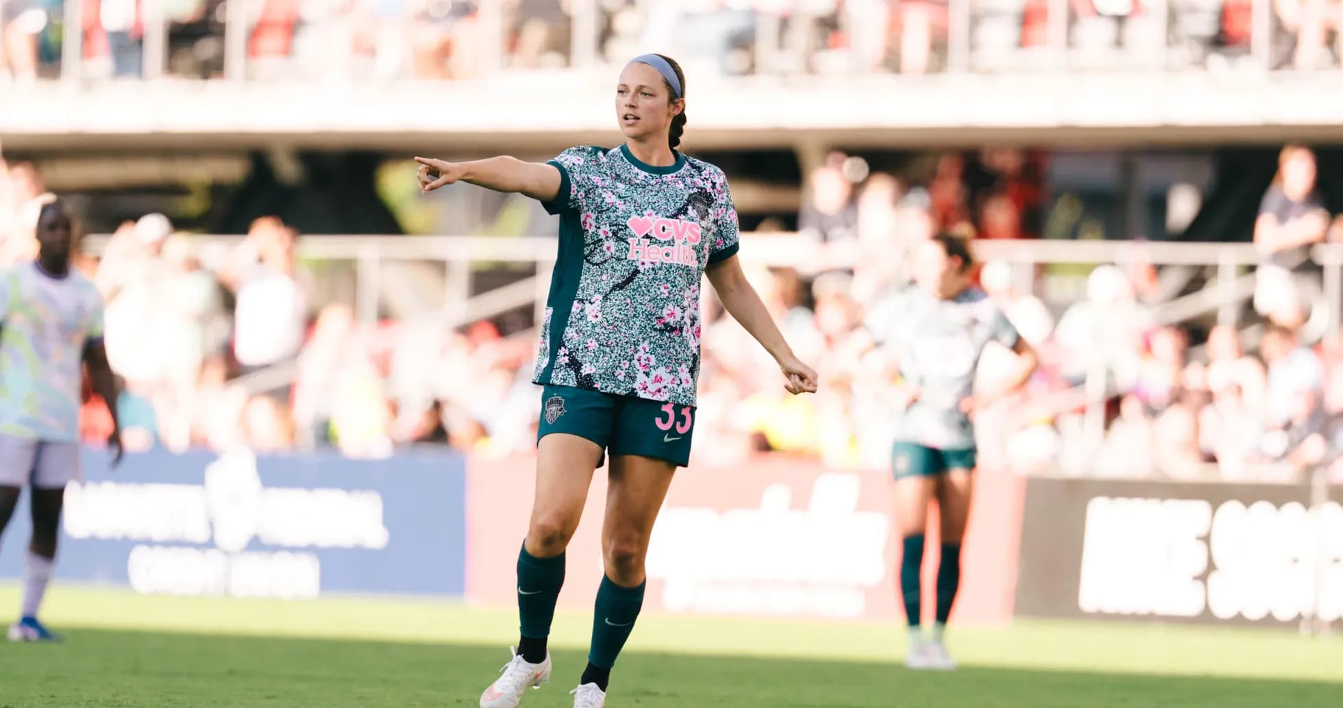 Player directing teammates during NWSL match