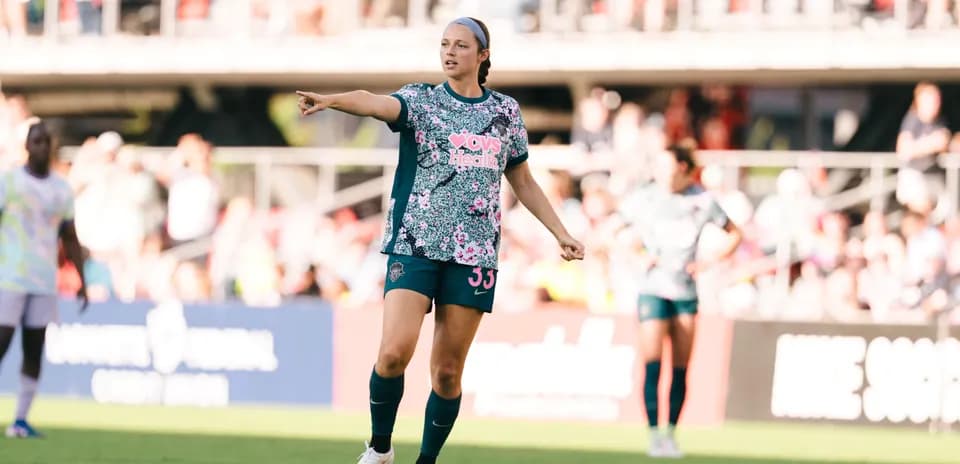 Player directing teammates during NWSL match