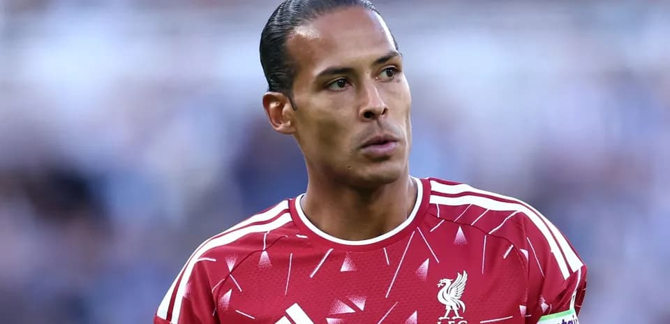 Player in Liverpool kit with captain armband