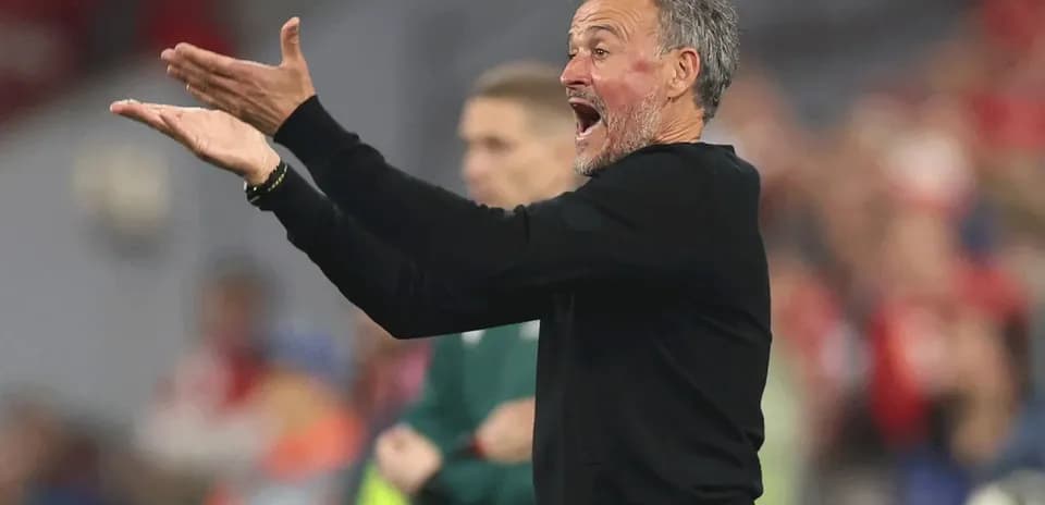 Coach gesturing on the sidelines during match
