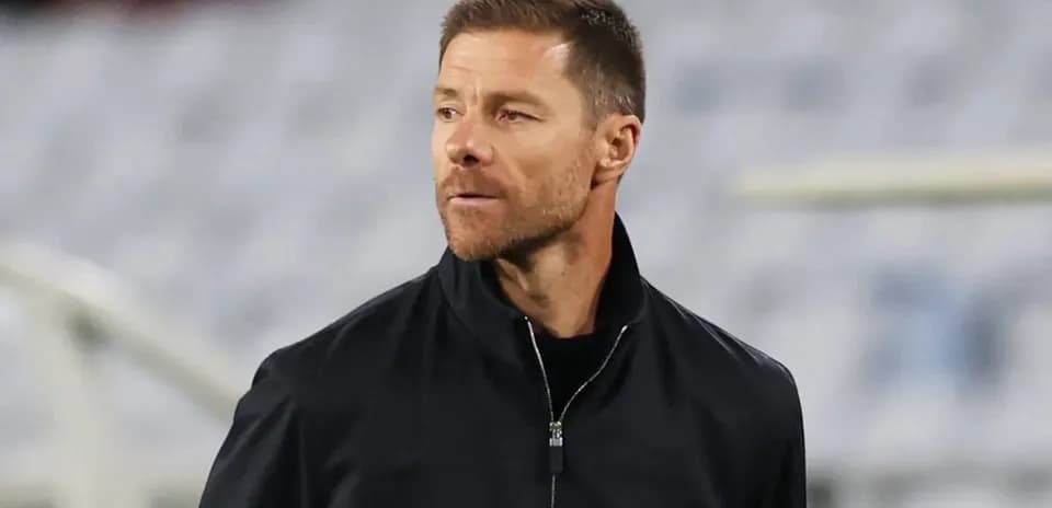 Coach observing during a match on the sidelines