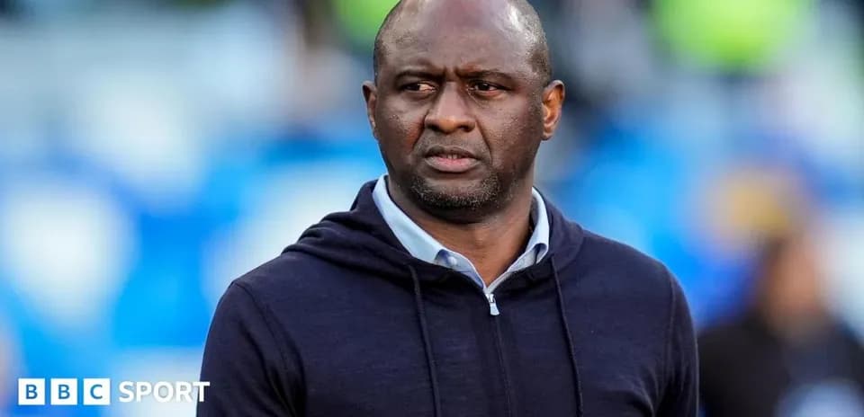 Manager observing match from the sidelines