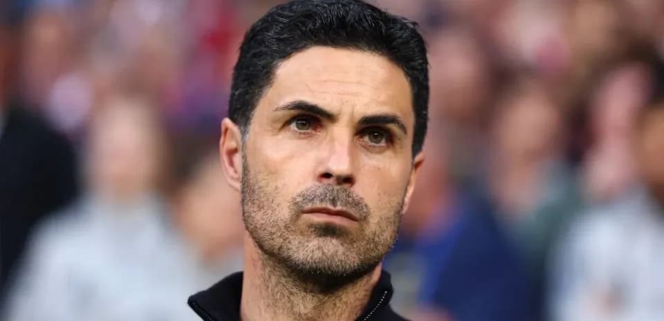 Manager focused during a match on the sidelines