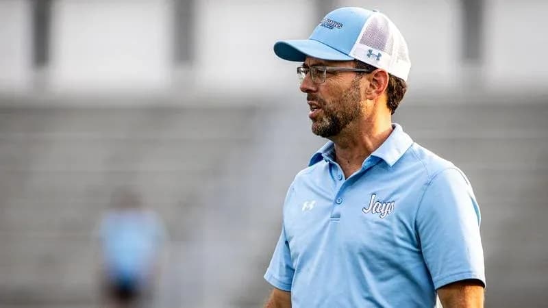 Coach speaking on the sidelines during practice