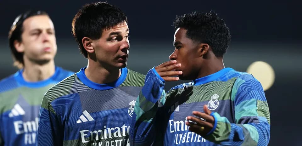 Two players discussing during training session at night