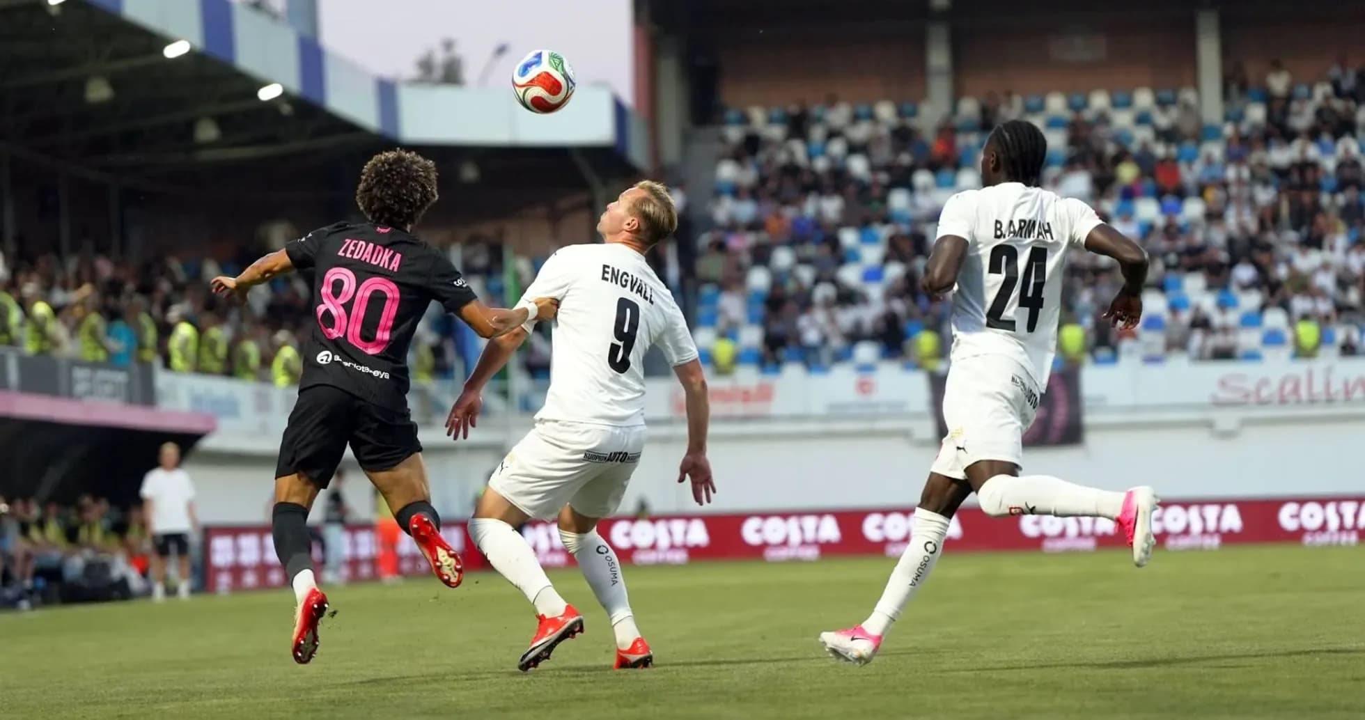 Players competing for the ball during match