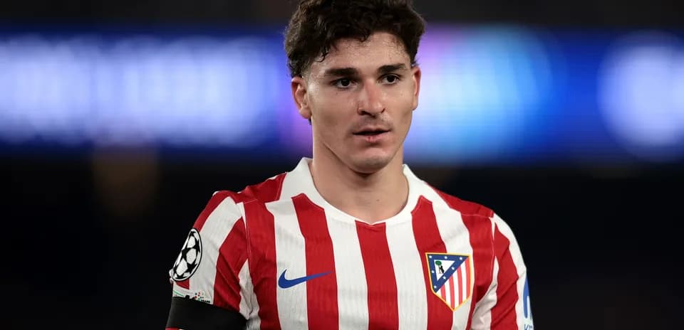 Atletico Madrid player wearing red and white jersey