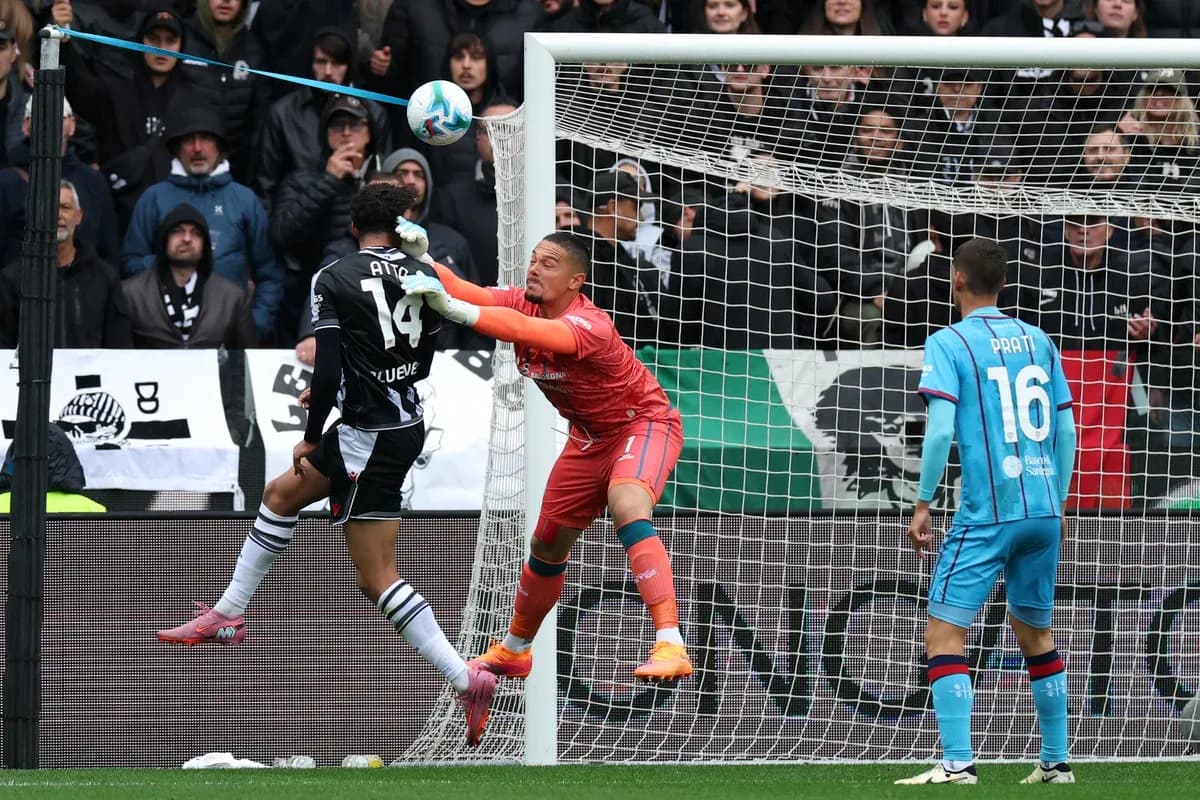 Goalkeeper defending against a striker's shot