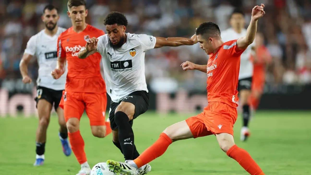Real Sociedad players contesting a ball against Valencia