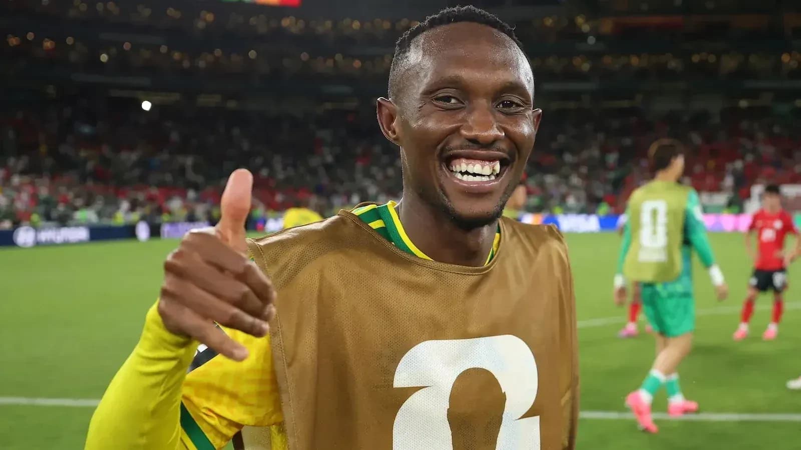Player celebrating with thumbs up on the field