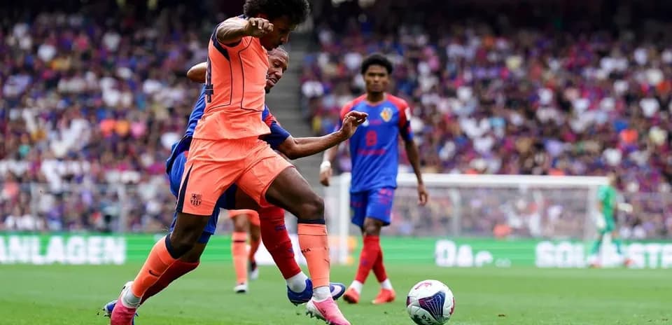 Player tackling opponent during football match