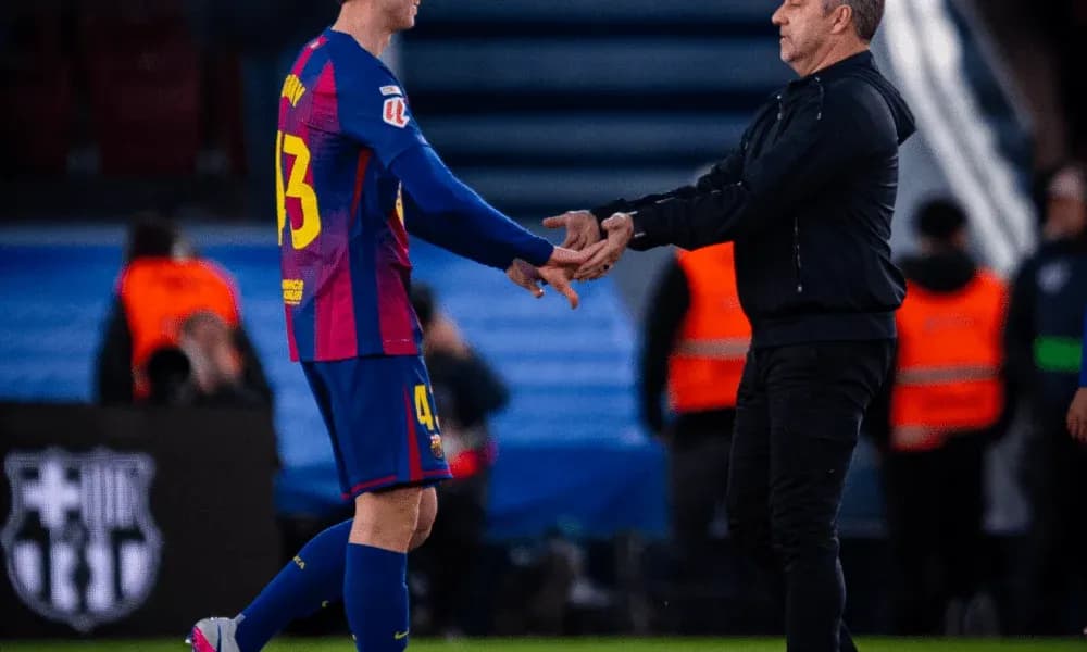 Player shaking hands with coach during substitution