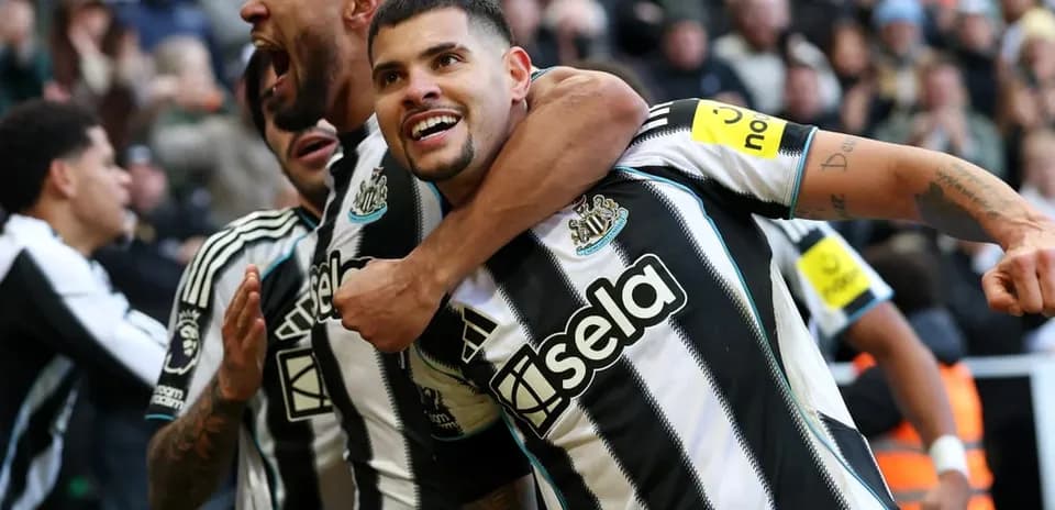 Newcastle players celebrating a goal during match