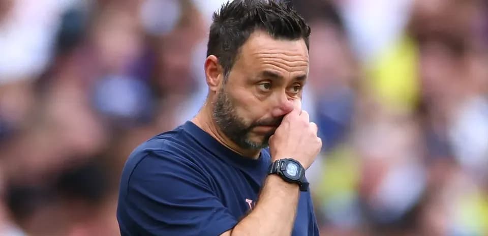Coach looking concerned during a match