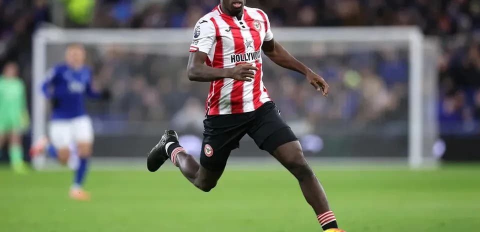 Brentford player sprinting during a football match