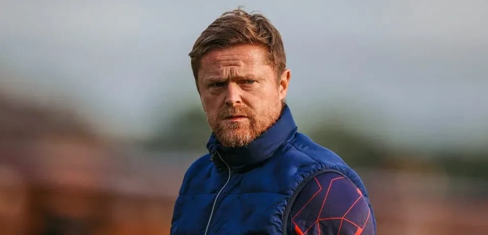 Coach observing during training session at field