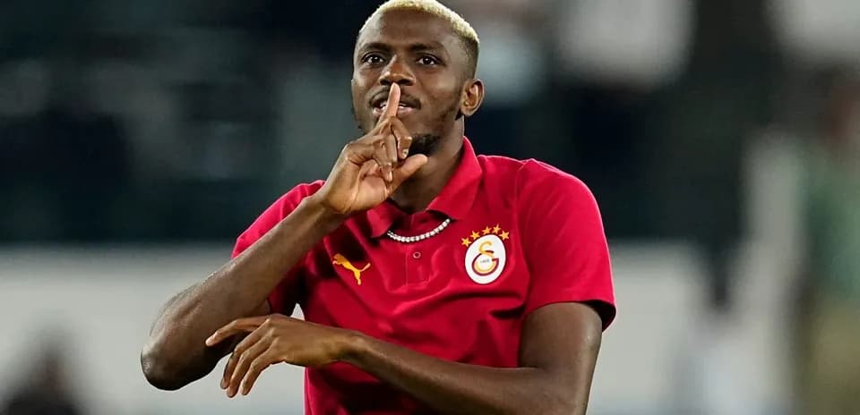 Player gesturing with finger to lips in celebration