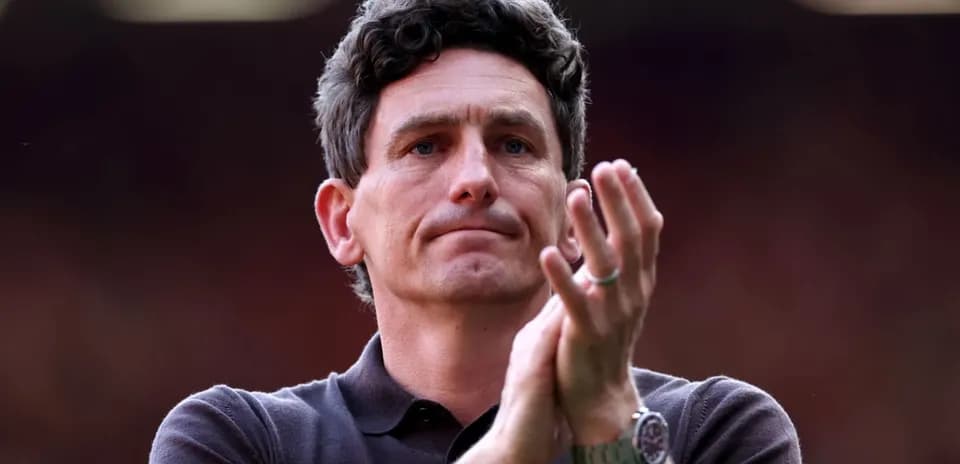 Man applauding in a sports setting