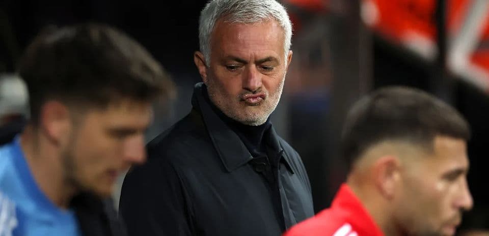 Manager observing players on the sidelines